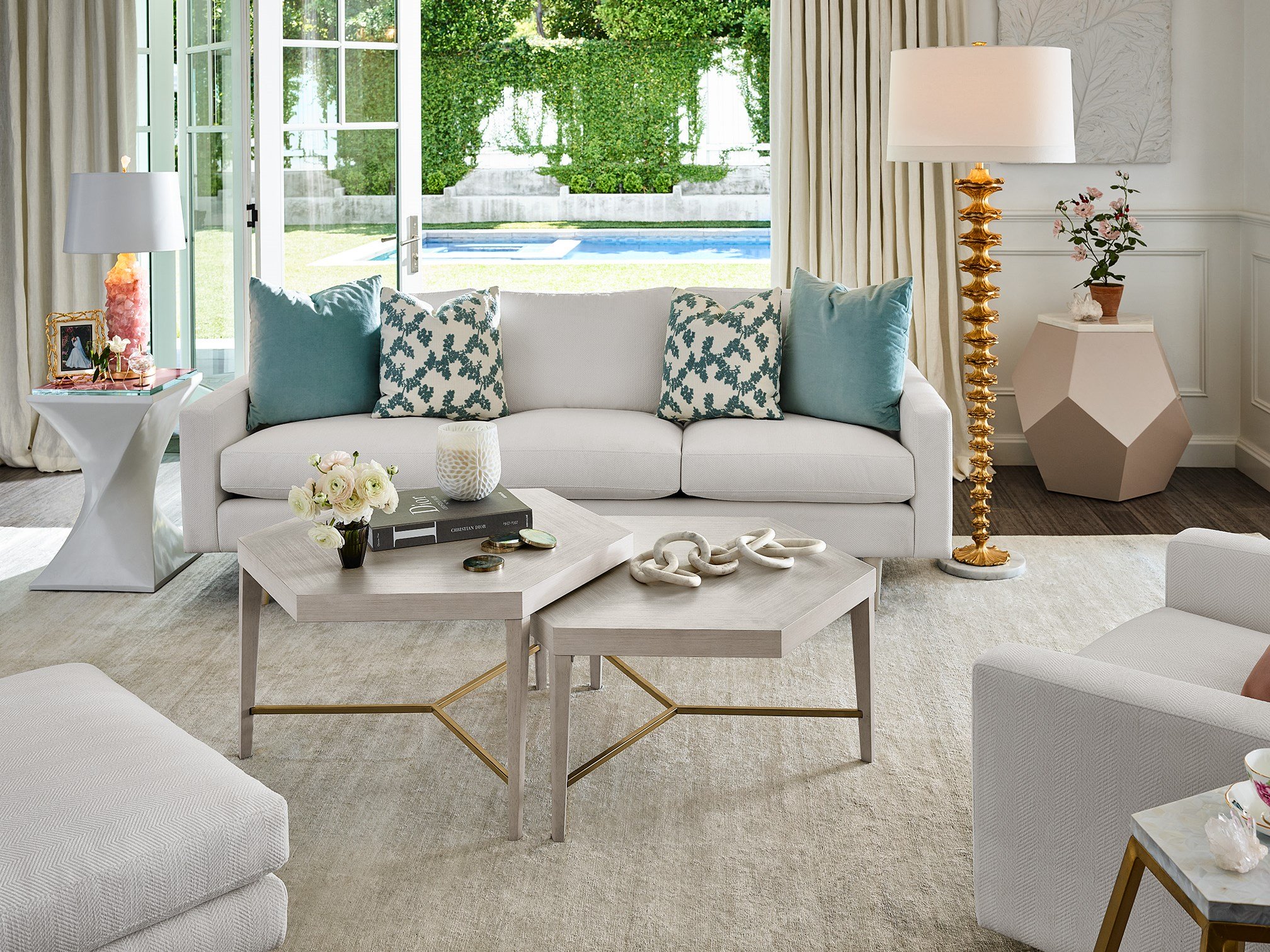 living room with white sofa and blue pillows